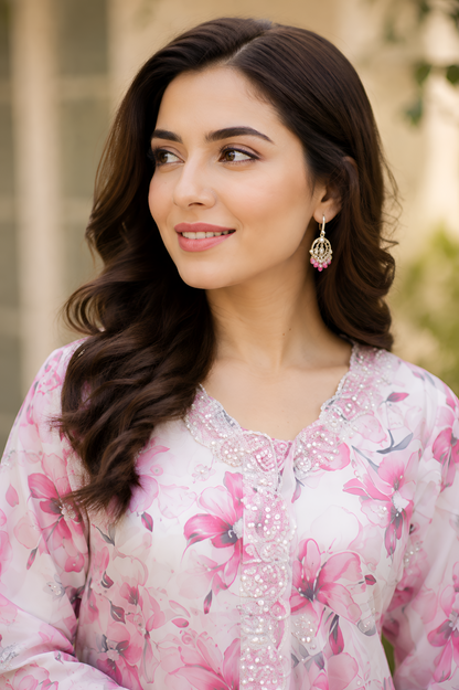 Shehr-e-Naaz digital printed crepe short frock with net embroidered lace neckline, silk charmeuse palazzo, digital printed silk dupatta, and handmade potli.