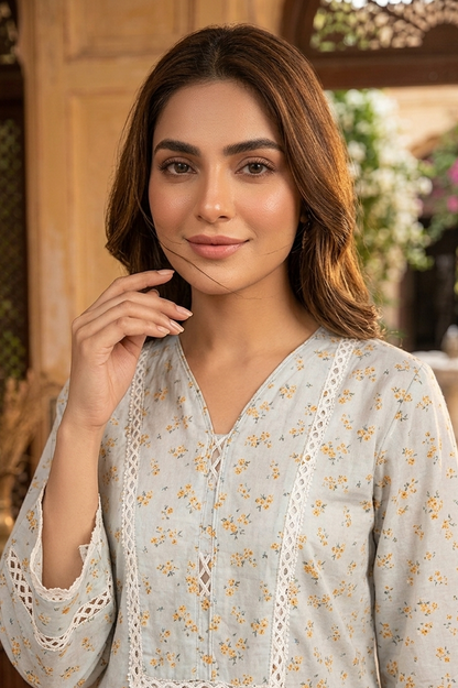 Serene Petals digital printed lawn 3-piece suit with tassel neck, lace-work daman, matching lawn trouser, and chiffon printed dupatta.