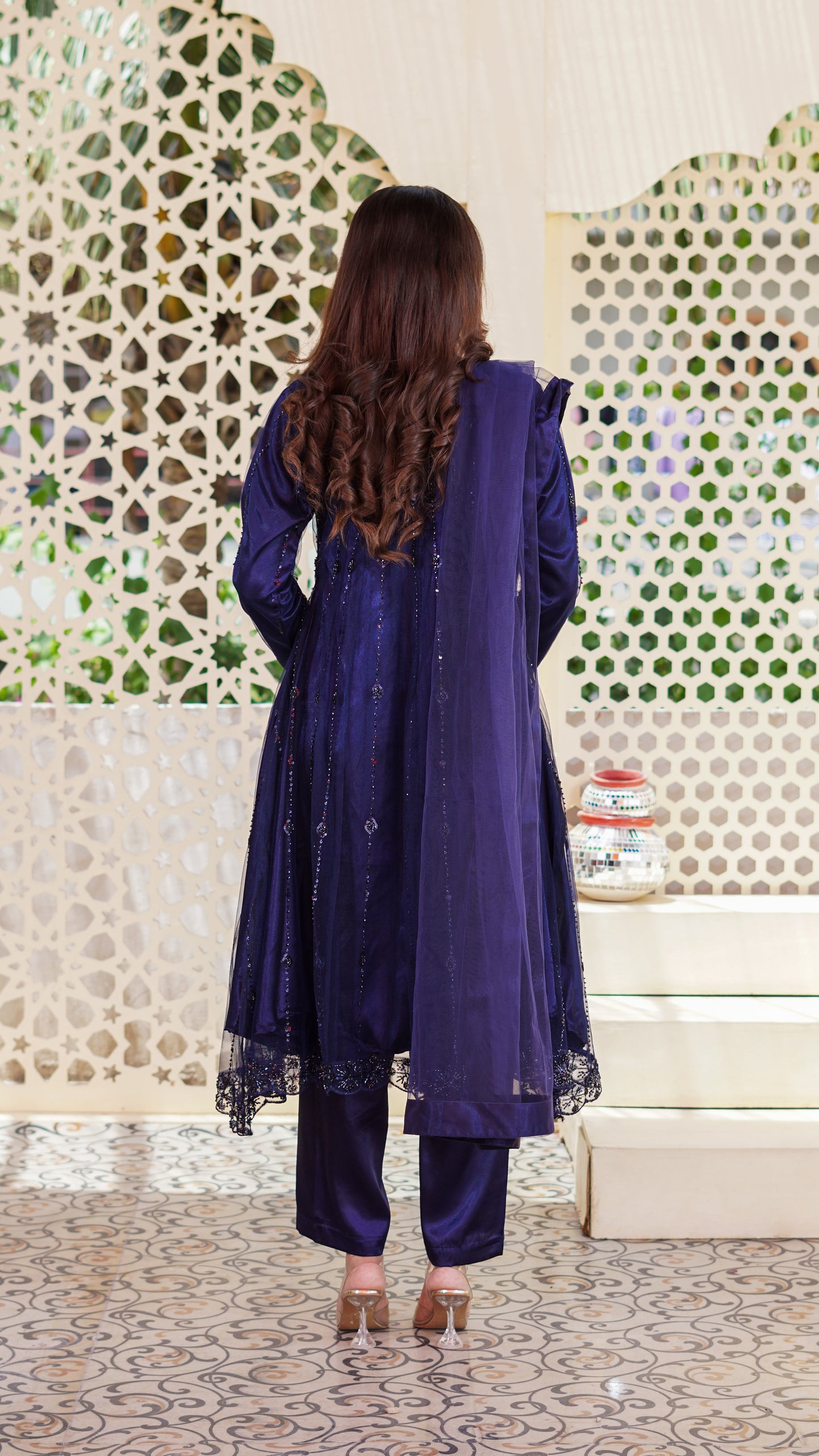 Ayla Luxe Pishwas featuring intricate net embroidery, elegant cutwork, handwork detailing, embroidered sleeves, satin silk trousers, a 4-sided embroidered net dupatta, and a handmade clutch.