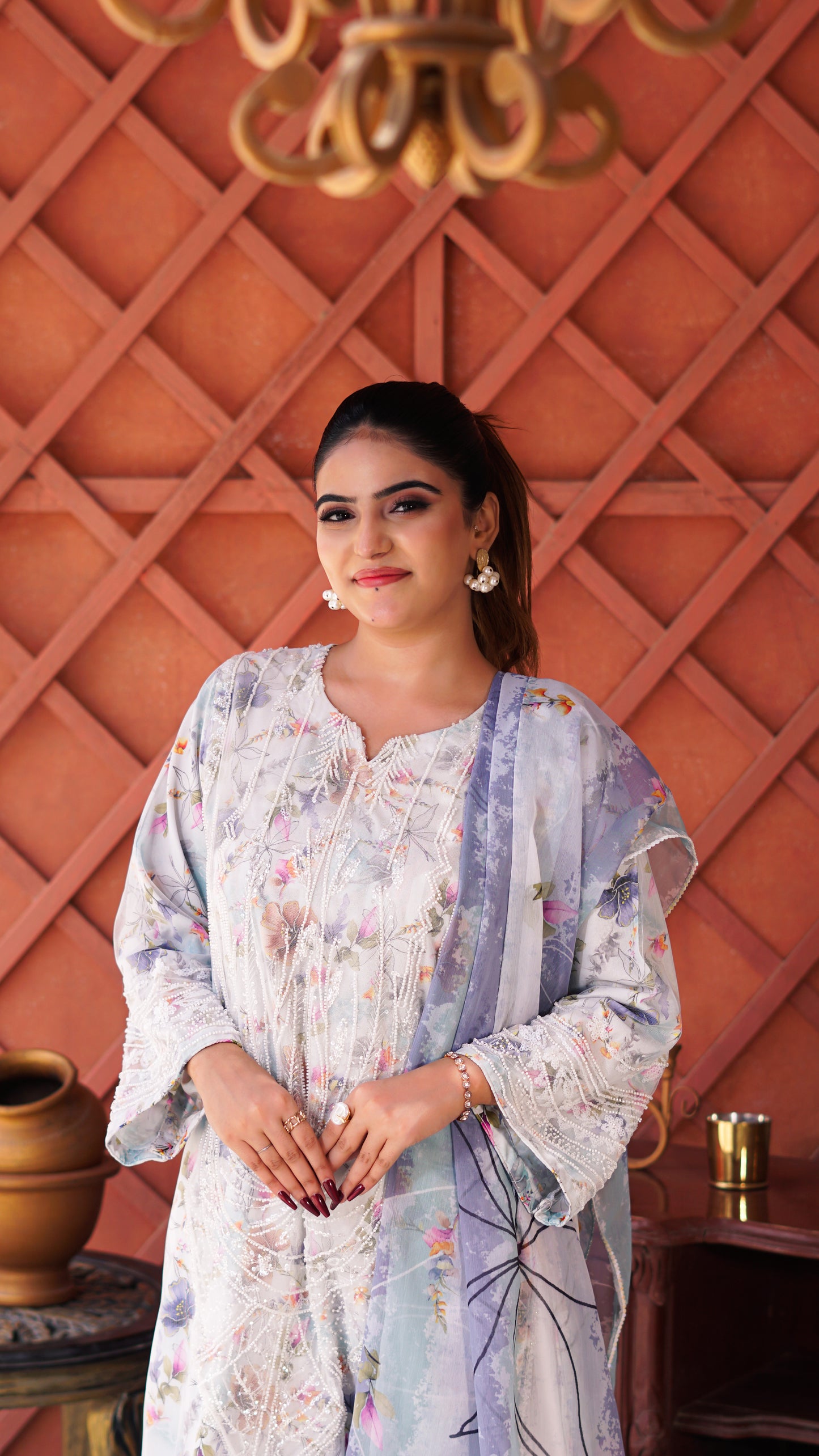 Mahroze Kurta Set featuring a light blue and white floral printed kurta with wide sleeves, white trousers, and beige heels.