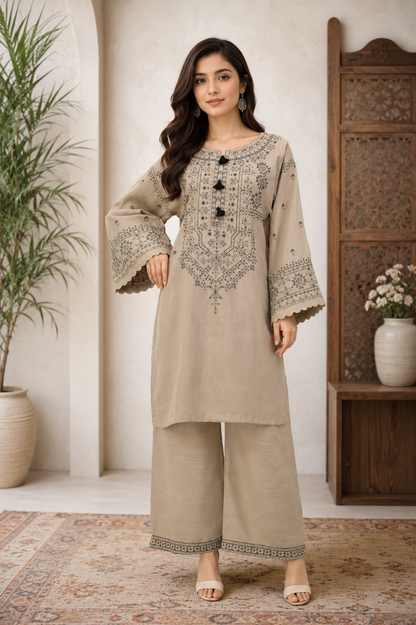 Women's cotton embroidered 2-piece kurta set with elegant thread embroidery, tassel neck design, embroidered sleeves, and matching flapper.