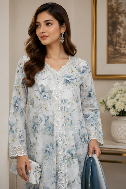 Shehr-e-Naaz digital printed crepe short frock with net embroidered lace neckline, silk charmeuse palazzo, digital printed silk dupatta, and handmade potli.